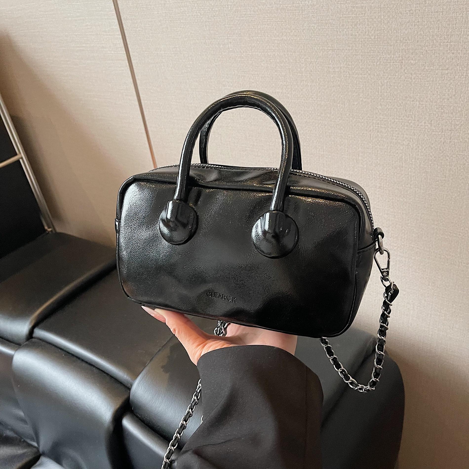 

Spring popular portable bowling bag women s new shoulder messenger bag niche pillow bag чорний