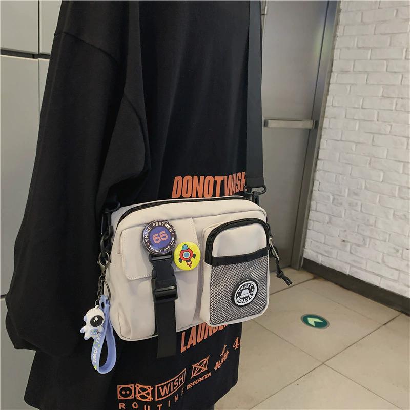 Unisex Plain Color Crossbody Bag, Casual Zipper Shoulder Bag with Astronaut Charm & Random Badge, Versatile Daily Messenger Bag