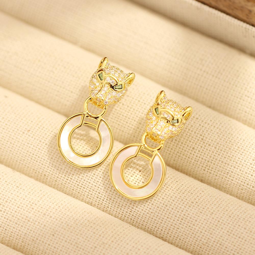 European and American classic high-end personality stone inlaid leopard earrings gold and silver two-color stone inlaid animal shell earrings silver n