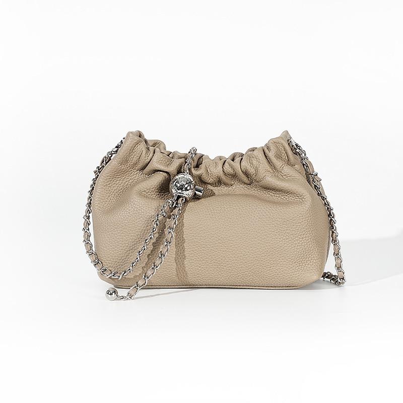 

Leather women s bag, high-end cloud pleated armpit bag, golden ball chain, first-layer cowhide shoulder messenger bag.