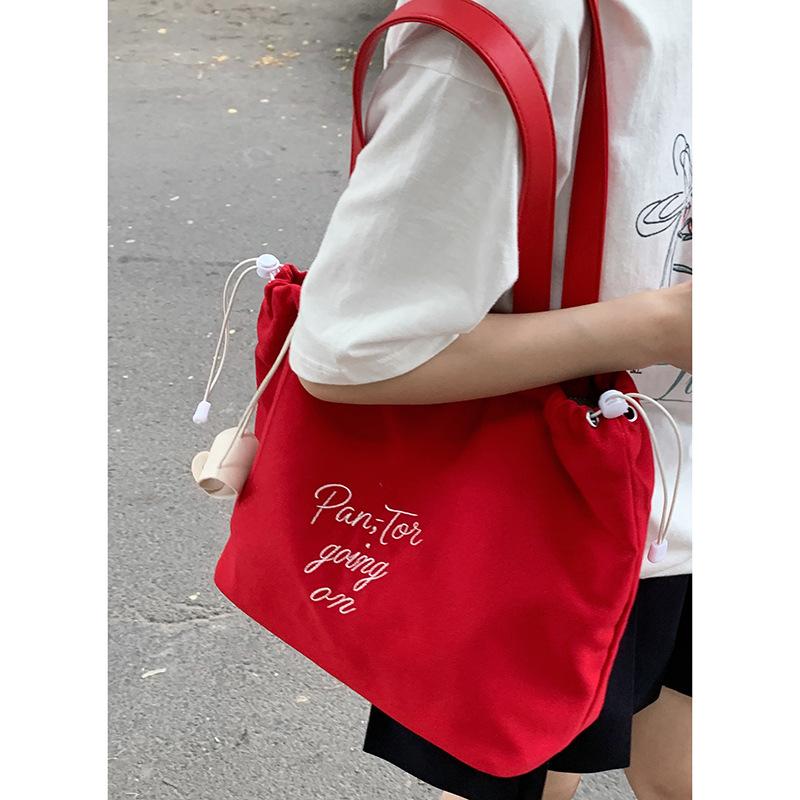 

Casual embroidered letter canvas bag women s 2025 new fashion Korean tote bag casual large capacity shoulder bag красный