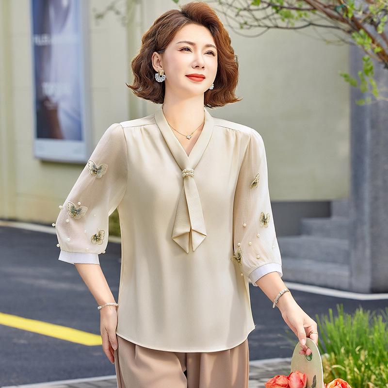 

Elegant Chinese Style Chiffon Blouse: Fashionable Summer Wear for Middle-aged Women 5XL абрикосовий