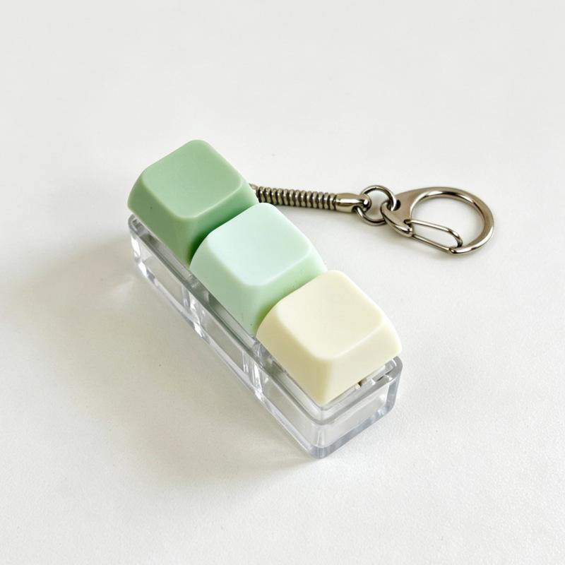 Sleutelhanger voor stressverlichting: Decompressie Kubus met Vier Knoppen & Toetsenbord Hanger