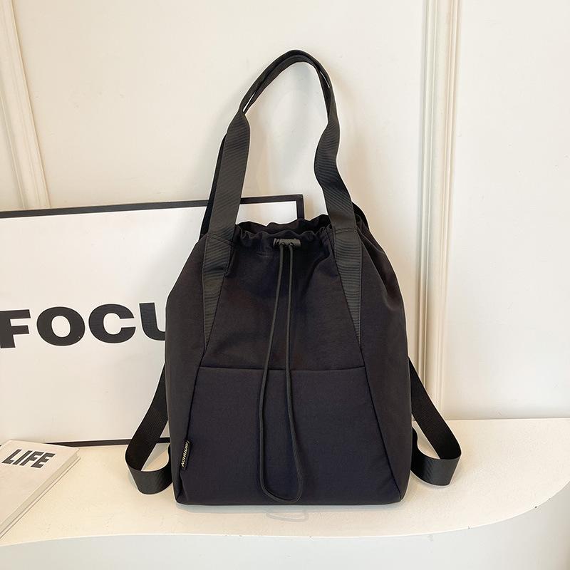 

Winter large-capacity travel bag, sports bag, backpack, drawstring bag, bundle bag, small fresh cycling tote bag. чорний