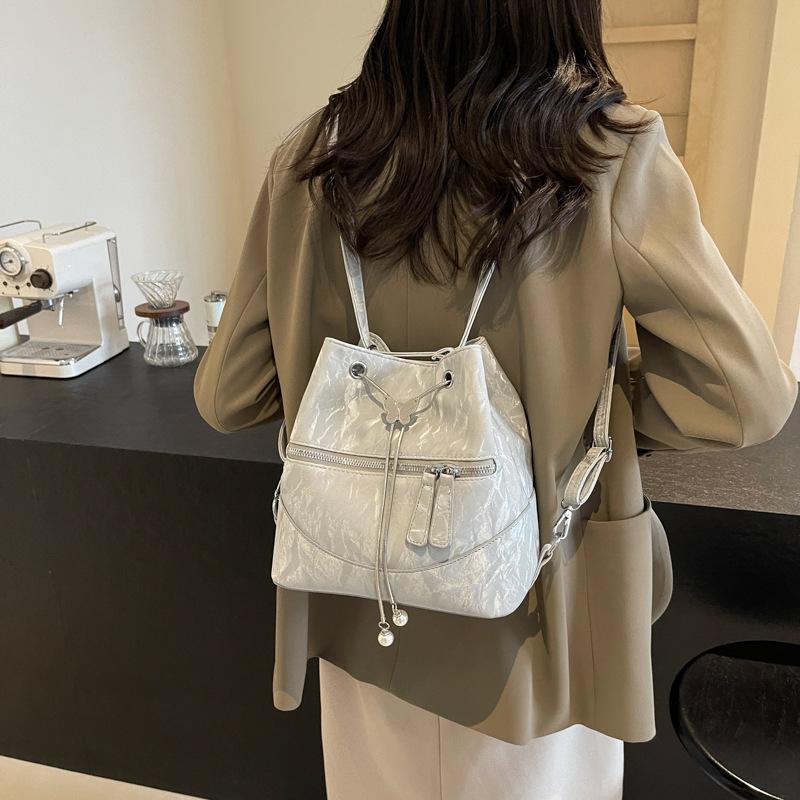 Silver bag women's 2025 new fashion backpack design sense school bag college student shoulder crossbody bucket bag