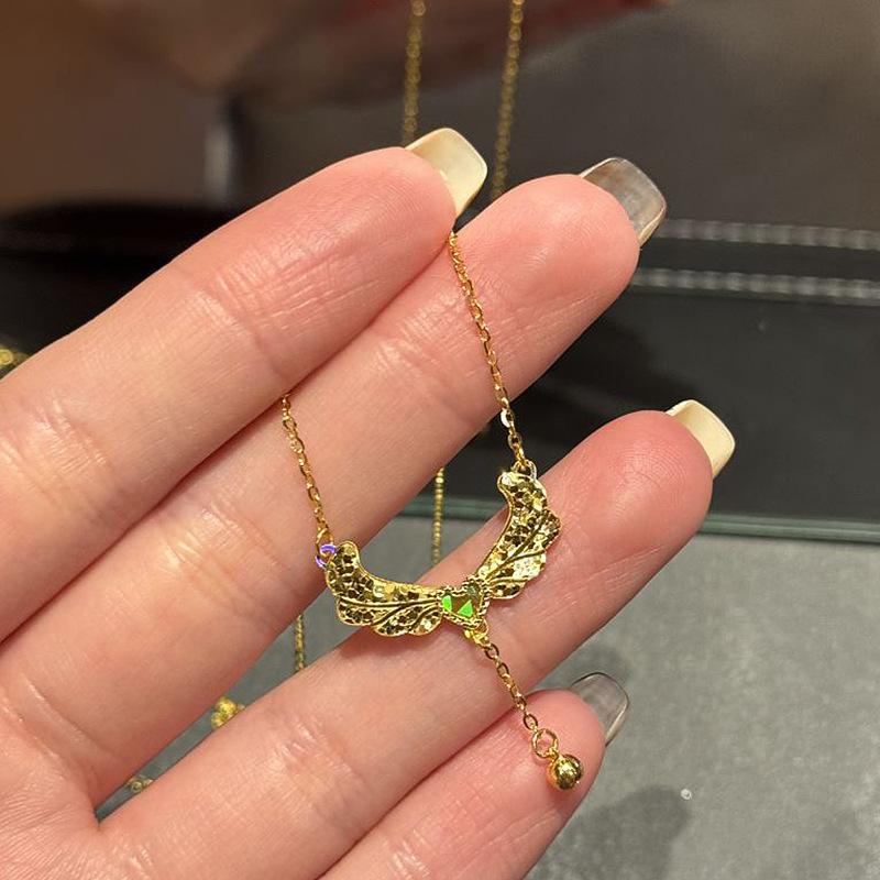 Inspiration design Glossy diamond studded crushed ice wings necklace heart-shaped tassel small golden ball collar chain