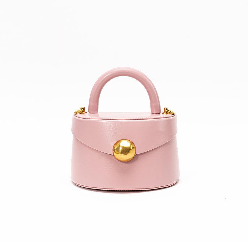 

Leather women s bag, high-end metal portable semi-round box bag, bucket bag, simple three-dimensional messenger bag. рожевий
