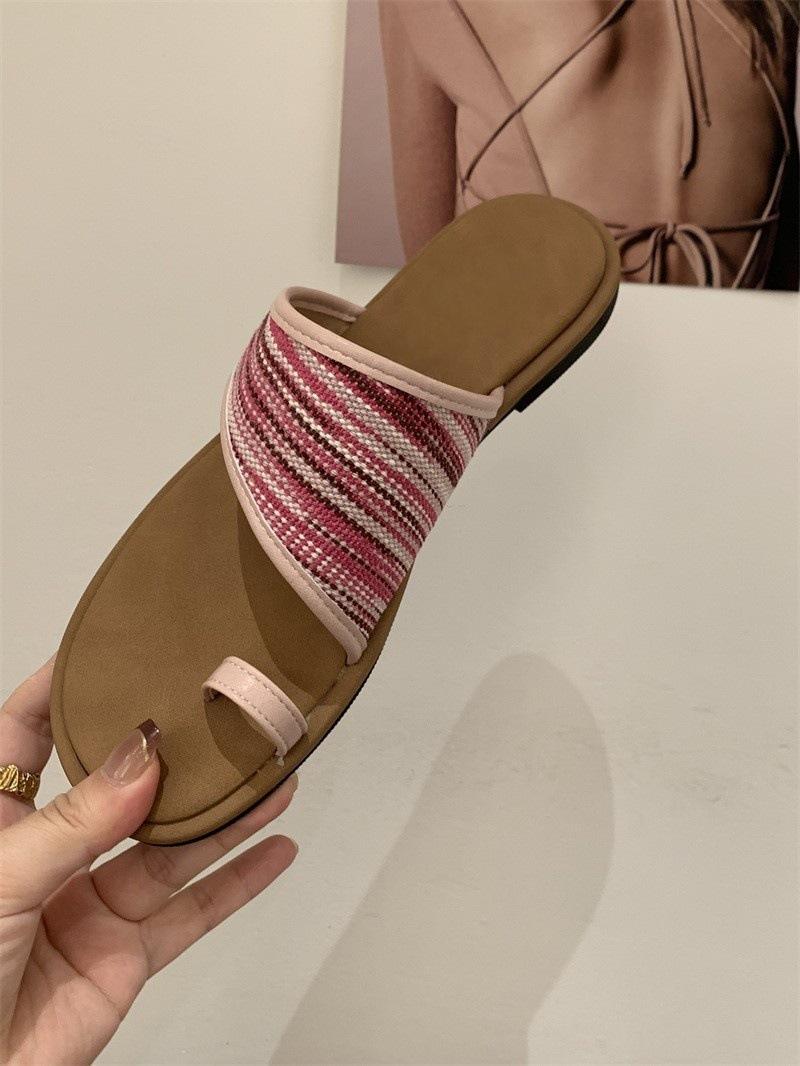 

Французские плетеные шлепанцы на одно слово женские 2025 новая летняя обувь в римском стиле пляжная обувь сандалии на плоской подошве 35