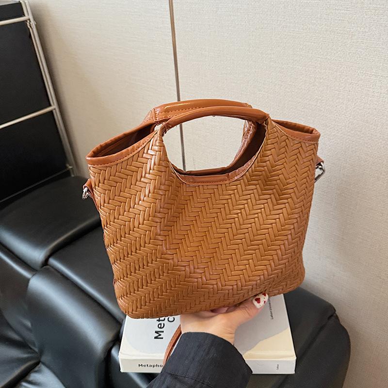 Simple and high-end portable mother and child bag women's summer new large-capacity messenger bucket bag