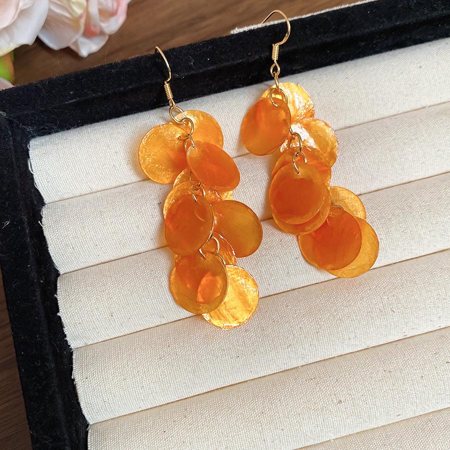 French Round Shell Tassel Stud Earrings: Retro, Exaggerated Style for a Unique Fashion Statement.