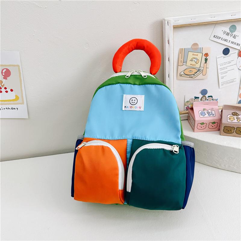 

Fun And Fashionable Kids Backpack In Pink Green And Blue With Animal Designs синій