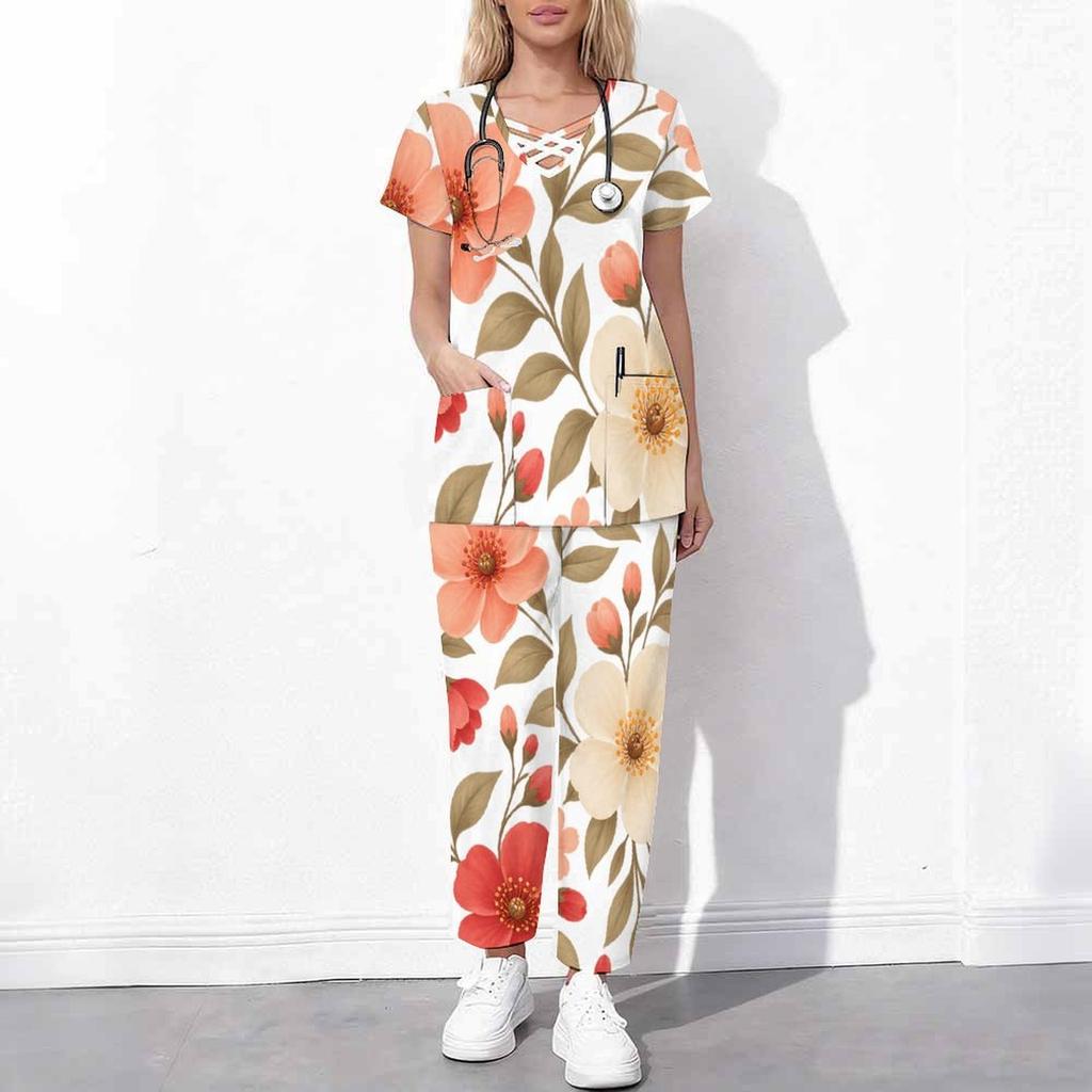 Women Plus Size White Floral Printed Scrub Set Crisscross Cutout Neck Short Sleeve Top With Pockets Long Pants Two Piece