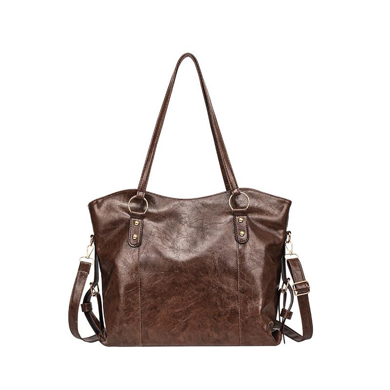 

Large-capacity commuter tote bag autumn and winter versatile shoulder bag hot-selling women s bag college student versatile underarm bag темно-коричневого кольору