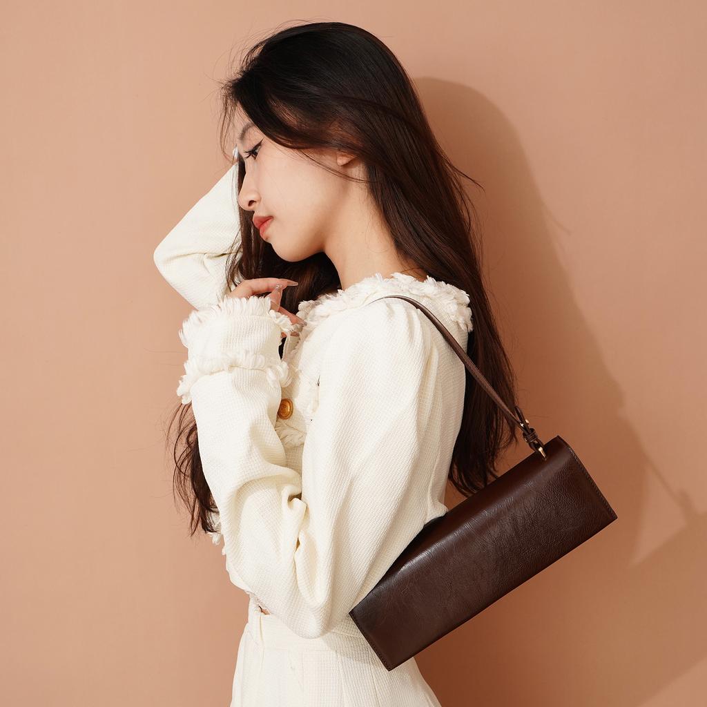 Cowhide underarm shoulder bag women's 2025 new high-end first layer oil wax drop pattern soft small square bag baguette bag