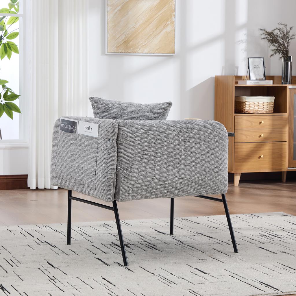Modern single armchair with comfortable fabric backrest and two storage compartments, complemented by a practical side table.