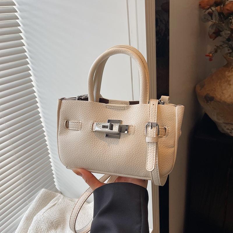 Premium Sense Hand Trage Tasche Damen Neue Mode Einfache Schulter Umhängetasche Nische Pendler Tasche