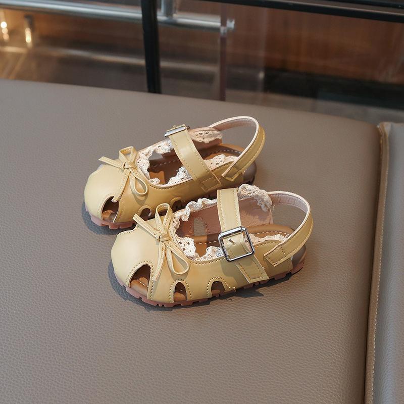 Children's Sandals2026New summer Korean-style versatile bow-knot princess shoes for girls, featuring a soft sole and designed for casual beach wear