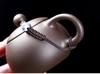 Zisha Travel Tea Set: Portable Xishi Pot with Quick-Brew Cup and Four Cups - Perfect for Outdoor or Home Tea Ceremonies.