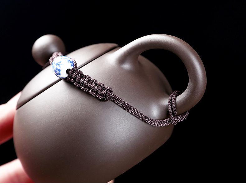 Zisha Travel Tea Set: Portable Xishi Pot with Quick-Brew Cup and Four Cups - Perfect for Outdoor or Home Tea Ceremonies.