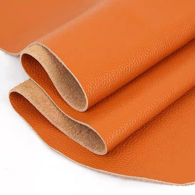 

Orange top layer cowhide material lychee pattern sofa seat headboard soft package leather fabric honey orange real cowhide mater 20x30cm помаранчевий