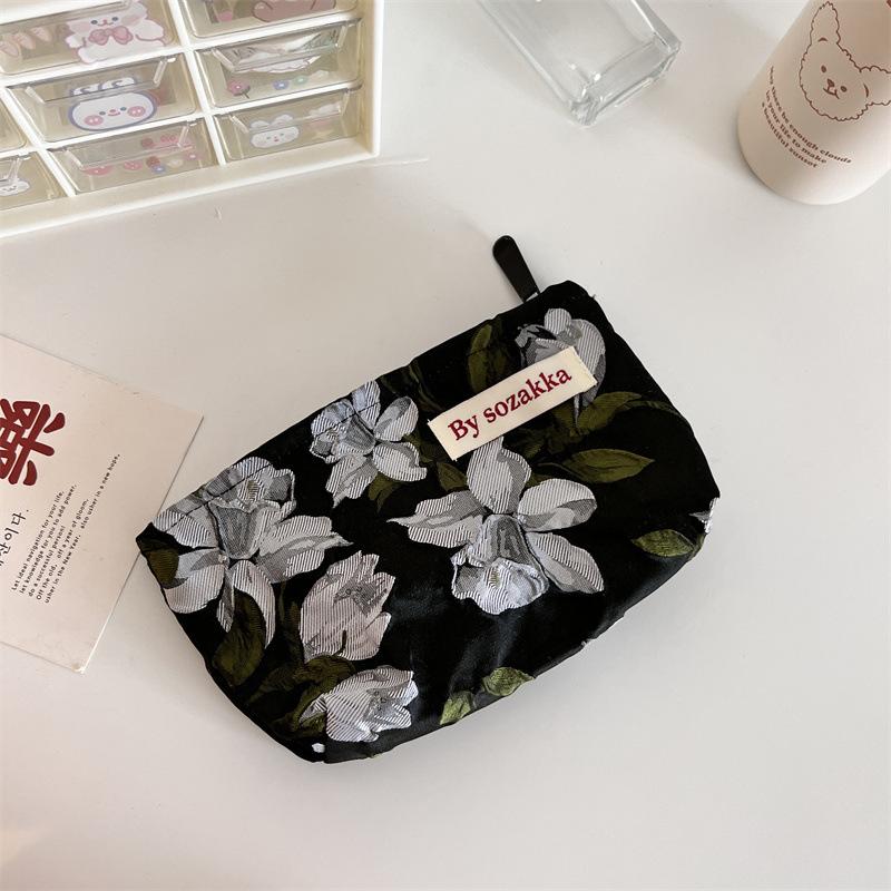 Trendy Ladies Simple And Portable Floral Embossed Cosmetic Bag For Use Everyday