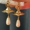 **Empress Dowager Saturn Pearl Earrings - Luxury Fashion Statement**