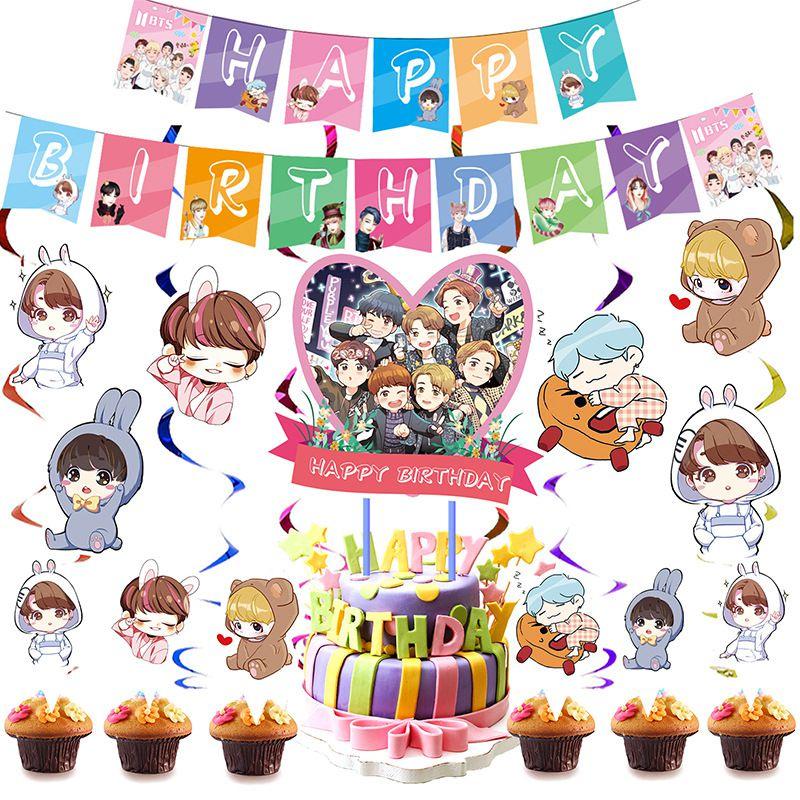Fournitures de fête d'anniversaire festives sur le thème de BTS avec un cake topper coloré et des cupcake toppers joyeux