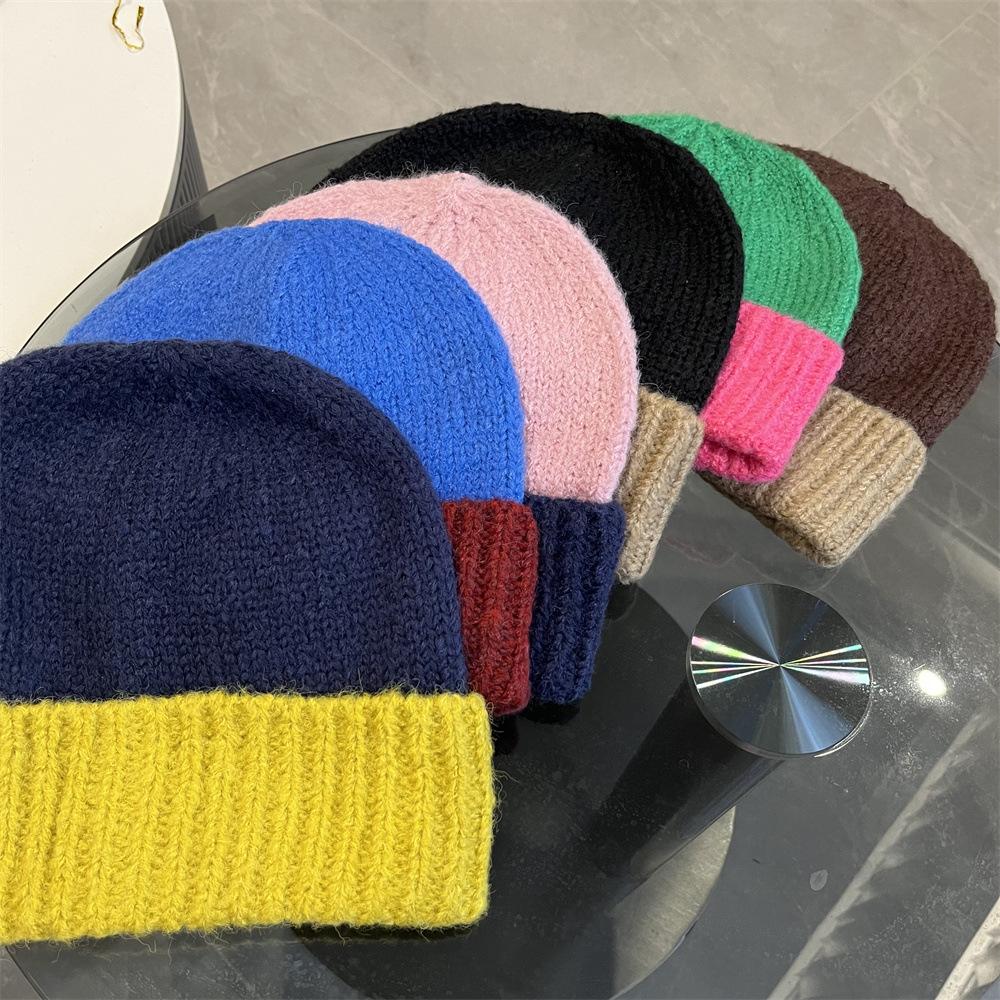 Simple two-color splicing wool hat women's autumn and winter warm niche versatile ear protection hat large version knitted pullover hat tide