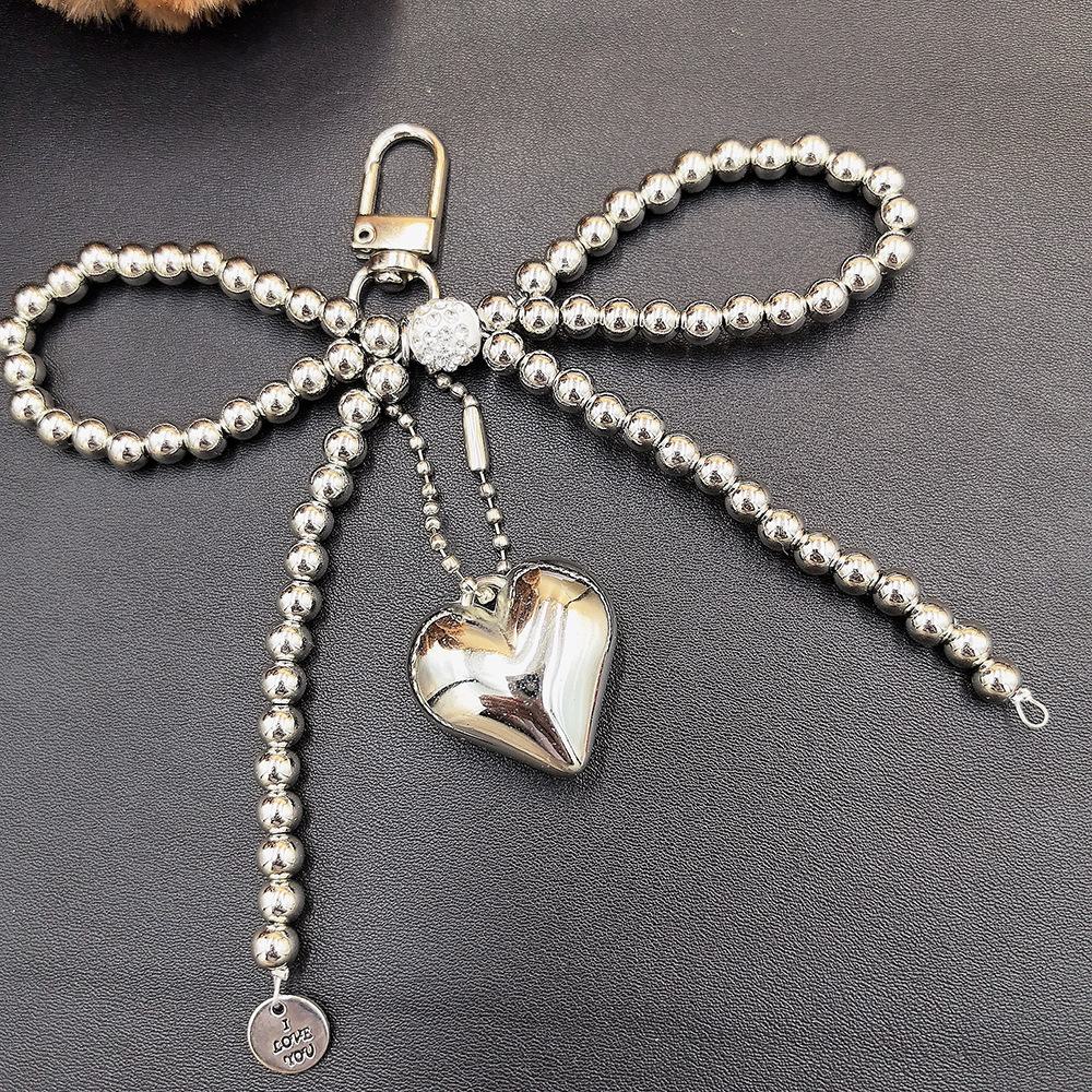 

Корейский шикарный брелок с подвеской Love в виде серебряного жемчужного банта и креплением AirPods для мобильного телефона