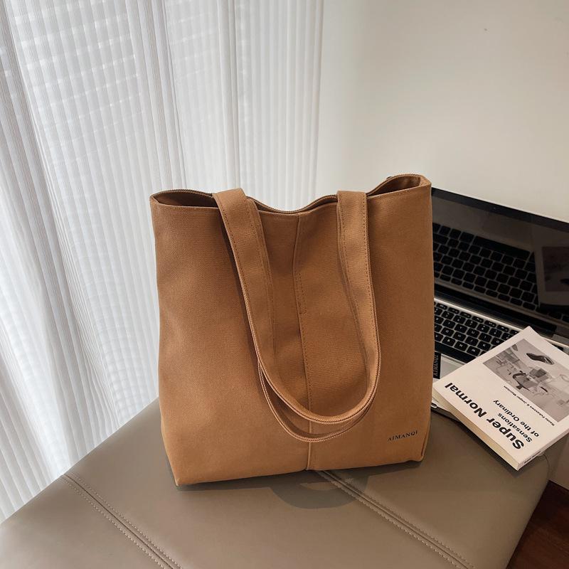 

Women s bag Large capacity commuter tote bag Canvas women s leisure bag New simple shoulder armpit bag