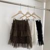 Spring 2026 Essential Korean Style Midi Skirt with Heavy Embroidery, Mesh Layers, and Lace-Up Hem.
