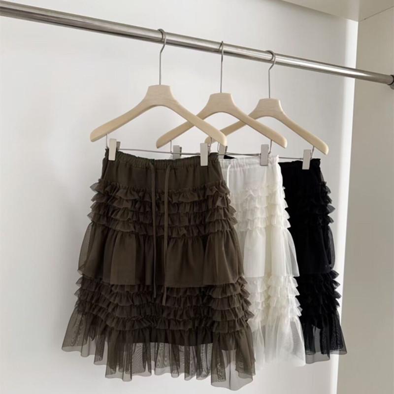Spring 2026 Essential Korean Style Midi Skirt with Heavy Embroidery, Mesh Layers, and Lace-Up Hem.