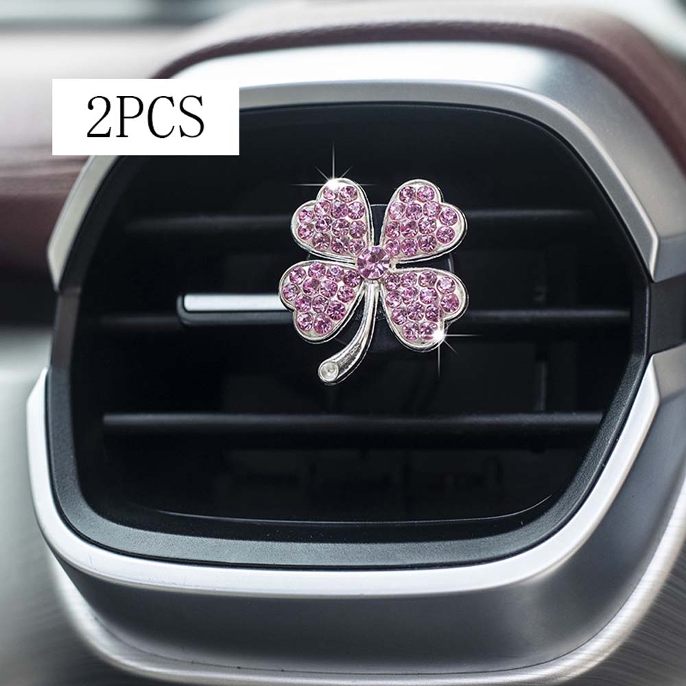 

2 PCS new car air outlet perfume pendant wholesale car aromatherapy four-leaf flashing grass car interior fragrance decoration розовый