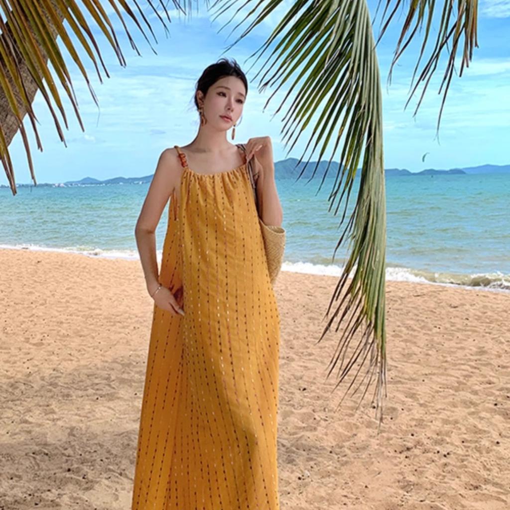 Seaside vacation style summer new dress women's clothing design sense loose yellow fringed suspender medium and long dress