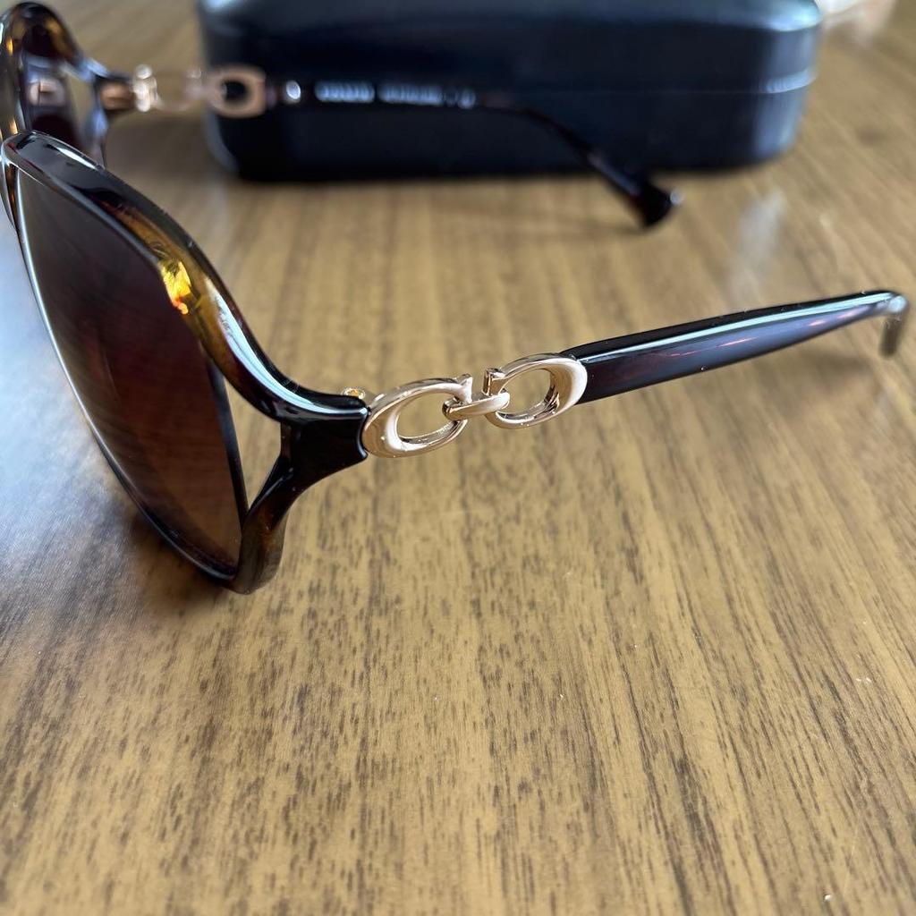 Used Coach ladies sunglasses case included