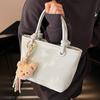 Korean version ins trendy personality contrasting colors casual hand carrying bucket bag fashion high sense versatile temperament messenger bag woman