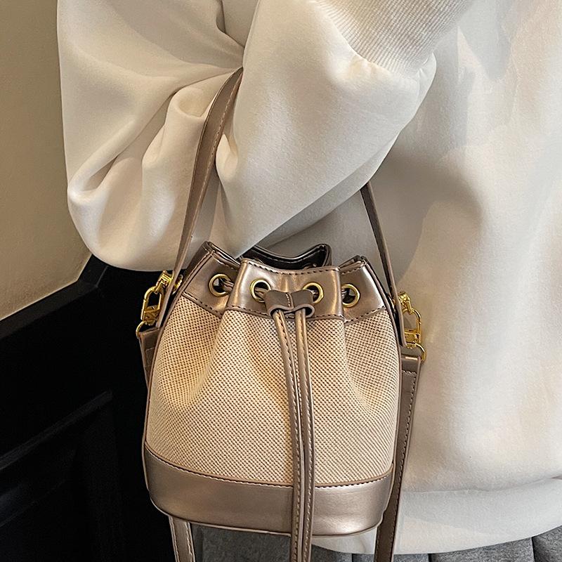 Fashion women's bags new niche high-value contrasting color shoulder messenger bag retro texture portable small bucket bag