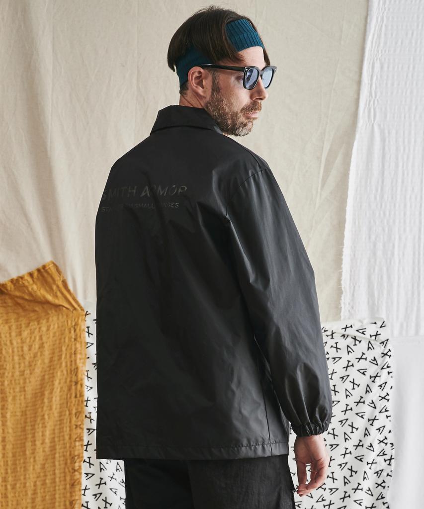 Smitharmor Sa See-Through Printed Logo Coach Jacket_Black
