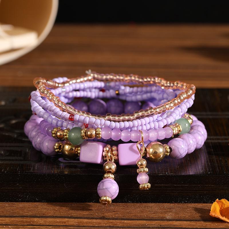 Böhmisches mehrlagiges elastisches Armband-Set: 8 Stränge kreativer Reiskornschmuck