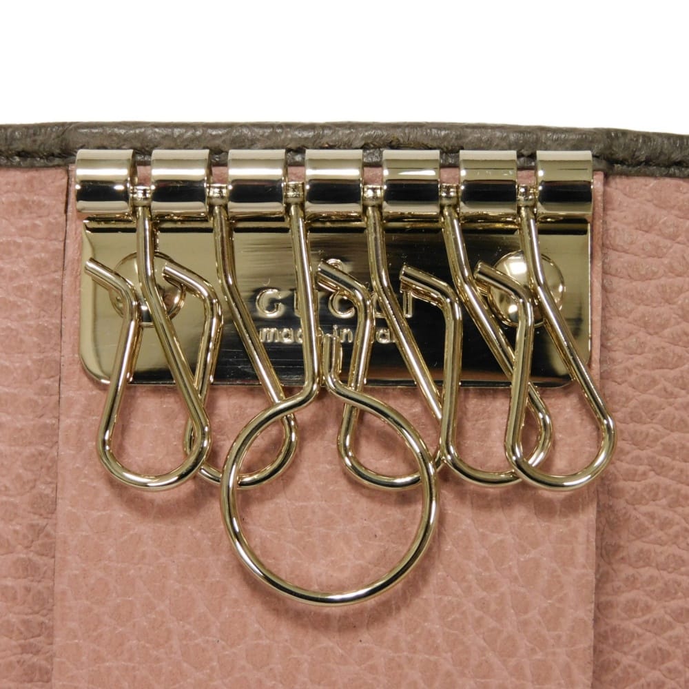 Used 6-ring keychain (product numbers 9539, 354499, CAO2G, 2160, 7949) in pink with a two-tone snap button and cursive
