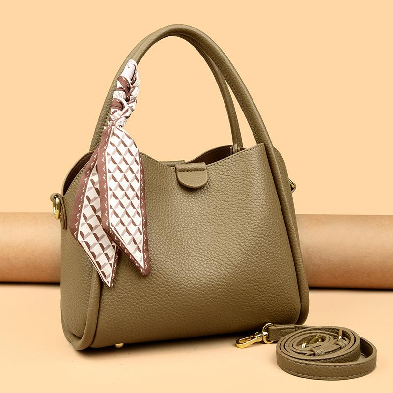 This Bucket Bag Is A Simple and Fashionable Urban Design with A Lychee Pattern and A Silk Scarf. It Is A Hand-held Shoulder Bag