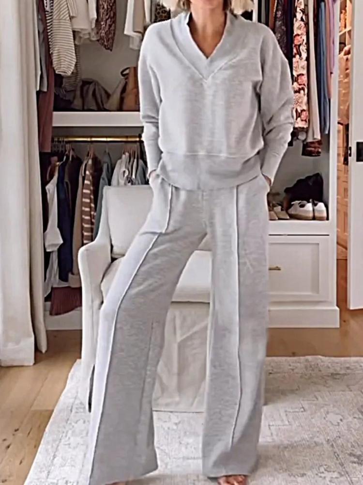 

Осенний повседневный комплект из двух предметов: свободный топ с V-образным вырезом и длинными рукавами и брюки широкого кроя. 5XL серый