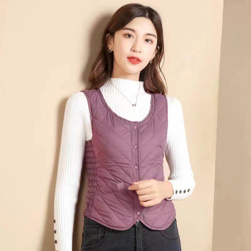 

Жіночий пуховий жилет, легкий і короткий, приталений і теплий, одягається всередину та назовні. Осінньо-зимовий жилет