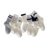 Fall/Winter Children's Socks From Fel Island, Retro Dark Blue School-style Pile Socks with Buttoned and Bow-tied Cuffs.