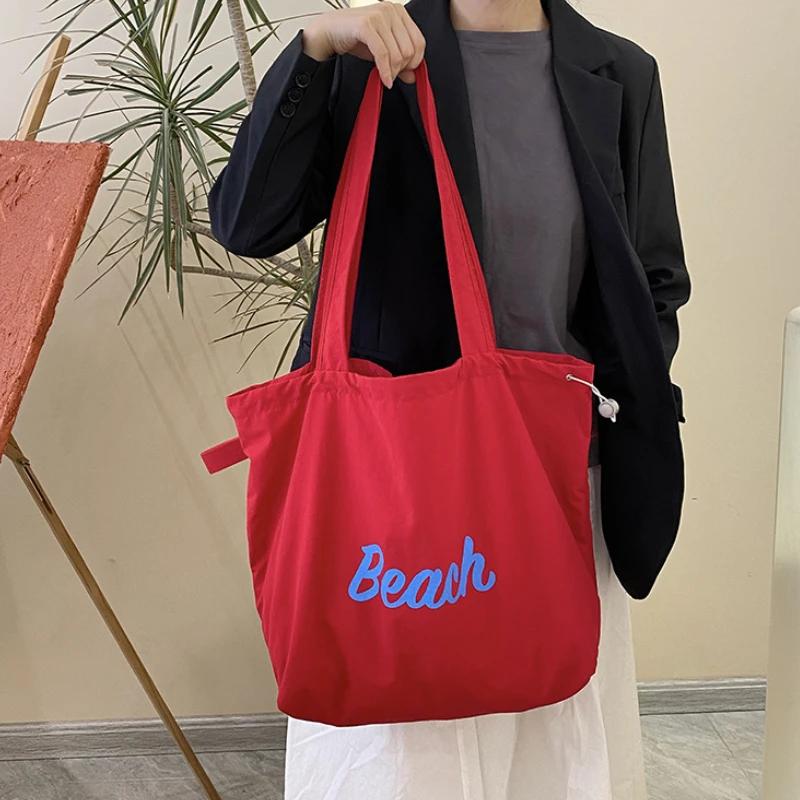 Einfarbige Damen Strand-Schultertasche mit Buchstaben-Design, Damen-Tote aus Canvas, Große Kapazität, Kordelzug, Damen-Einkaufstasche