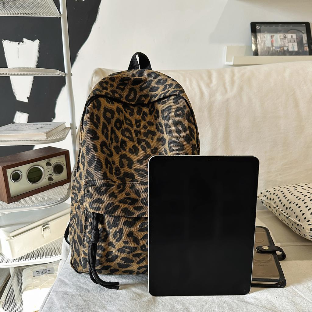 Leopard Print Backpack Casual Daily Use Trendy Street Style Lightweight Backpack for Women with Tassel Detail for School Travel and Everyday Outings