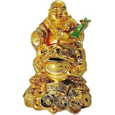 Śmiejący się Budda feng shui jako element dekoracyjny i błogosławieństwo dobrego szczęścia i sukcesu ze złotem