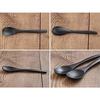 Stylish and smooth to the touch, this oval (black) bamboo spoon is a must-have.