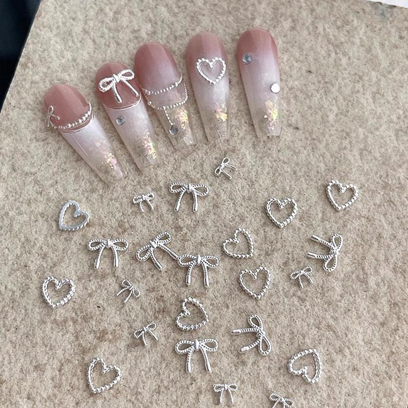 10 st Legering Rosett Kärlek Naglar Konst Berlocker Dekorationer 3D Lyx Metall Silver Rosetter Formade Smycken Diy Manikyr Design Tillbehör