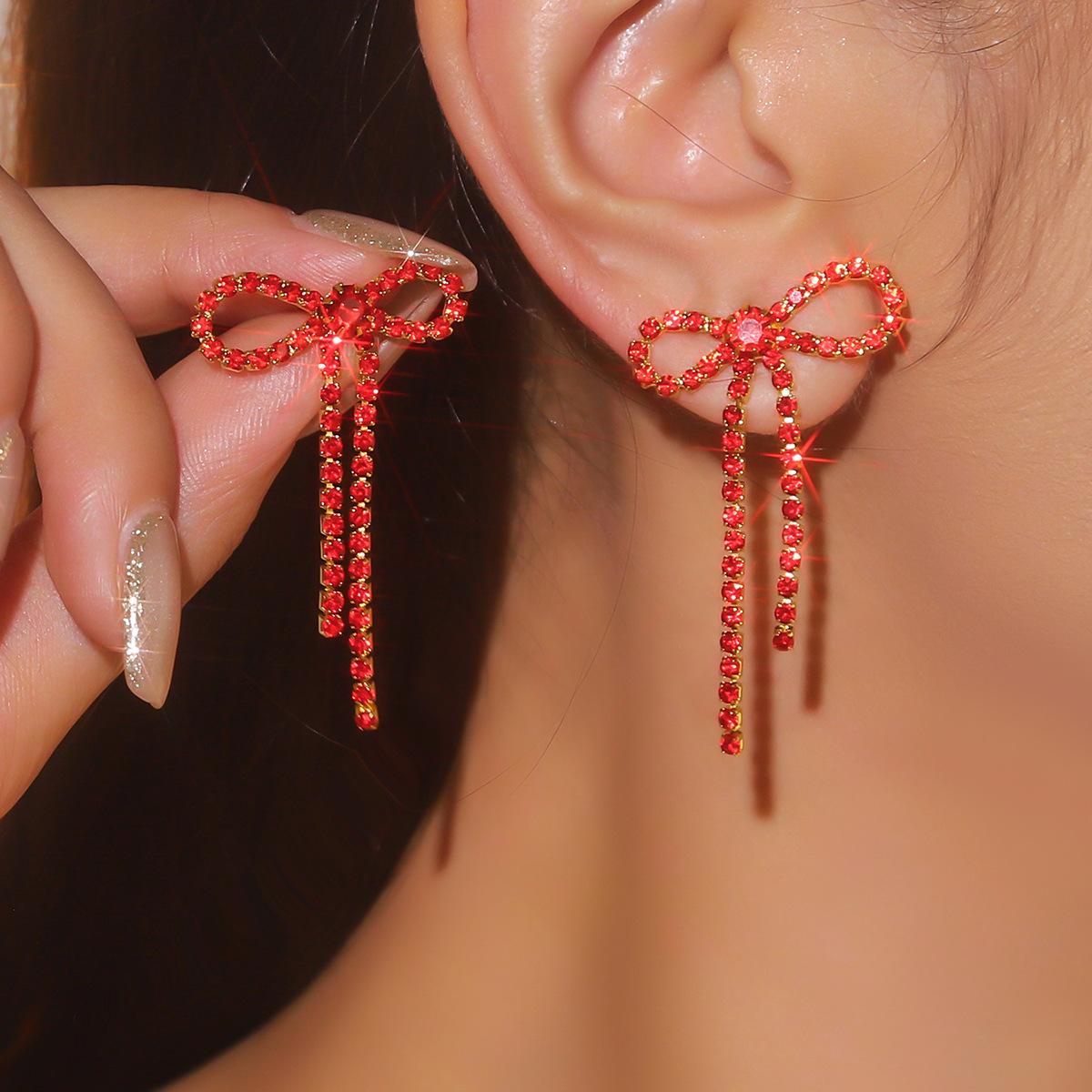 

Жіночі сережки з китицями з бантом. Блискучі діамантові сережки